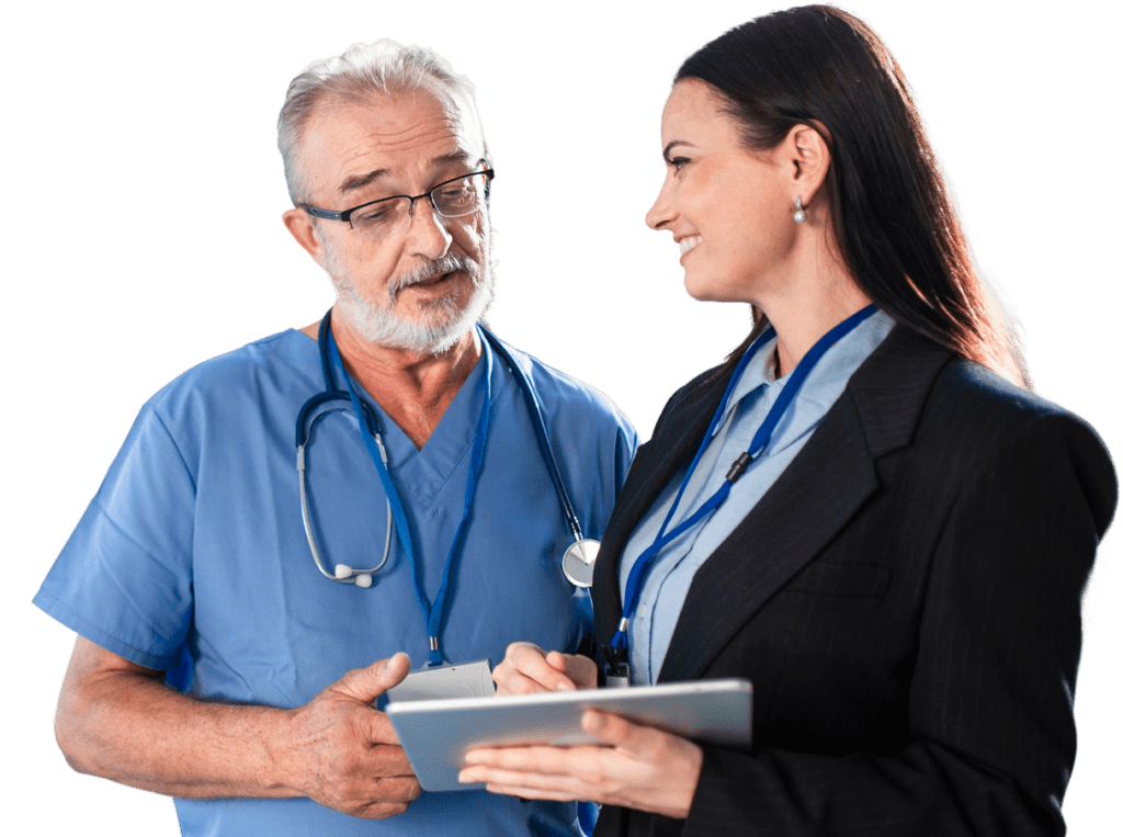 A man in medical scrubs and a woman in a suit holding a tablet have a discussion.